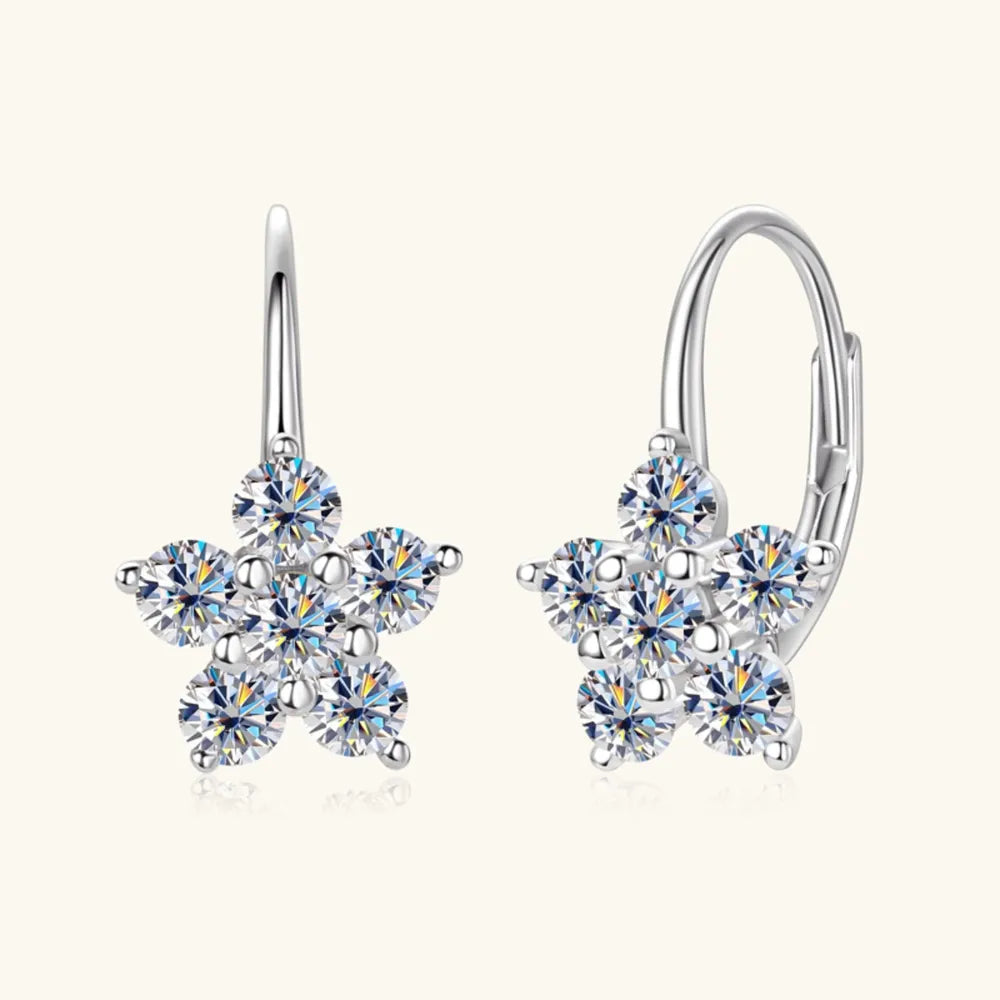 Sterling silver moissanite flower huggie earrings with 1.2 carats, featuring sparkling gemstones and a delicate floral design.