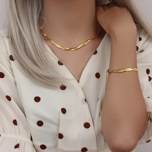 Eprolo 18K gold plated herringbone chain necklace and bracelet set displayed on a neutral background.