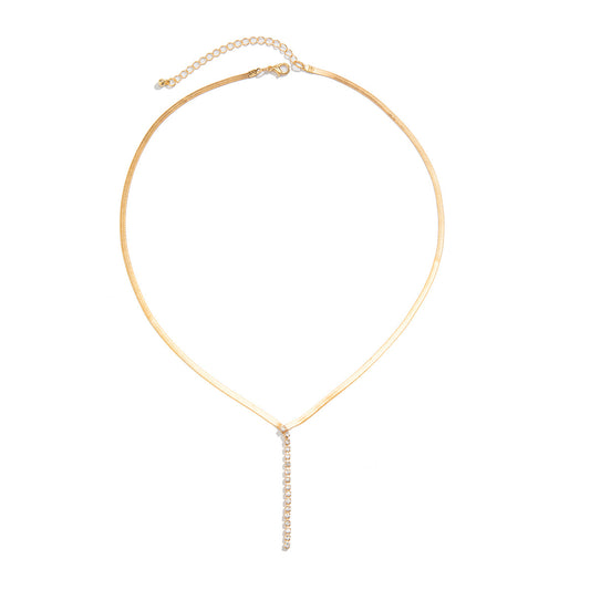 Gold-tone Snake Bone Y-Drop Crystal Tassel Necklace featuring a snake bone pendant and sparkling crystal tassels.