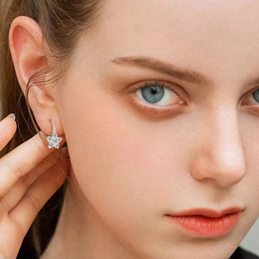 Sterling silver moissanite flower huggie earrings with 1.2 carat total weight, crafted by eprolo, featuring sparkling gemstone details.