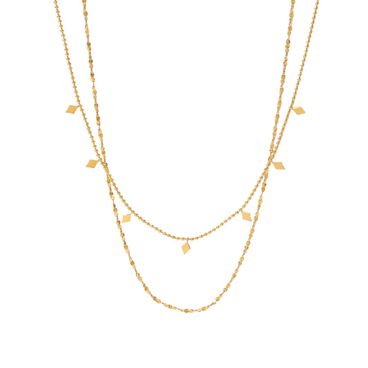 Eprolo double-layer tassel collarbone necklace with French style design, featuring delicate chains and tassel accents.