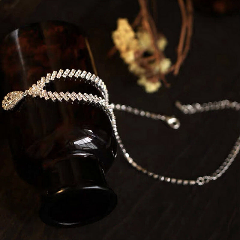Eprolo claw chain water drop necklace and earring set featuring elegant dangling water drop pendants.