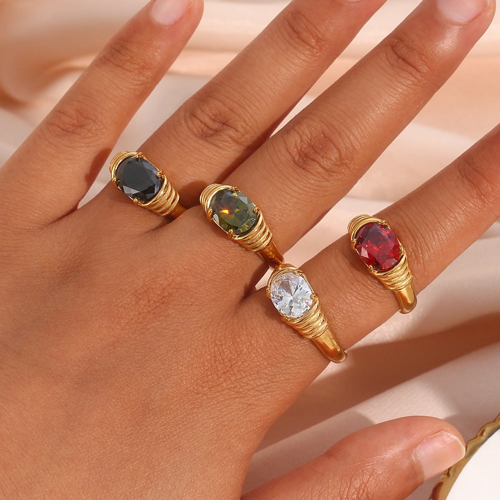 Oval-cut prong set 3A zircon ring in 18K gold plated finish, featuring a sparkling central gemstone and elegant band design.
