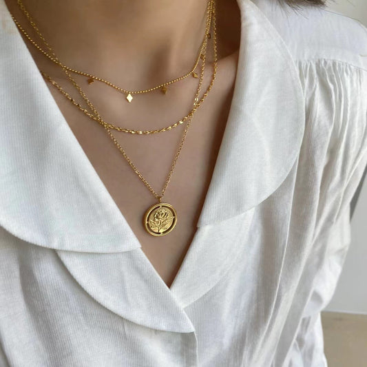 Eprolo double-layer tassel collarbone necklace with French style design, featuring delicate tassel accents on layered chains.