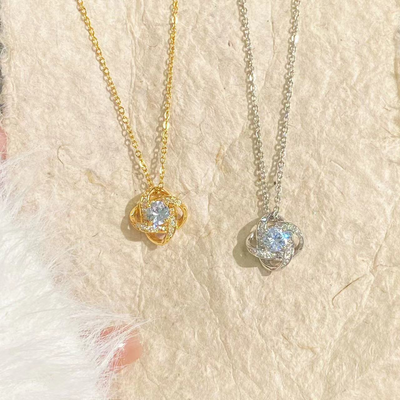 Gold-plated spinning lucky clover heart pendant necklace with intricate design, showcasing a delicate jewelry piece by eprolo.
