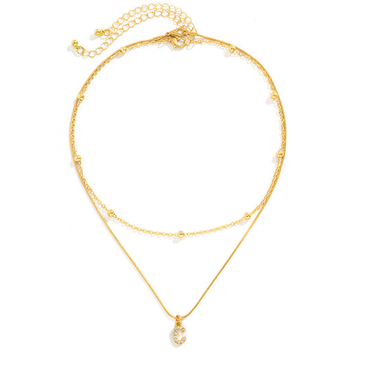Simple diamond studded English letter pendant, double-layer necklace collarbone chain, versatile snake bone necklace for women - AstroVerse™