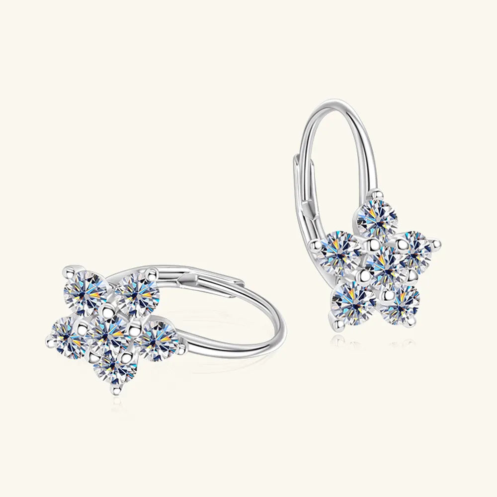 Sterling silver moissanite flower huggie earrings with 1.2 carats, featuring intricate floral design and sparkling gemstones.
