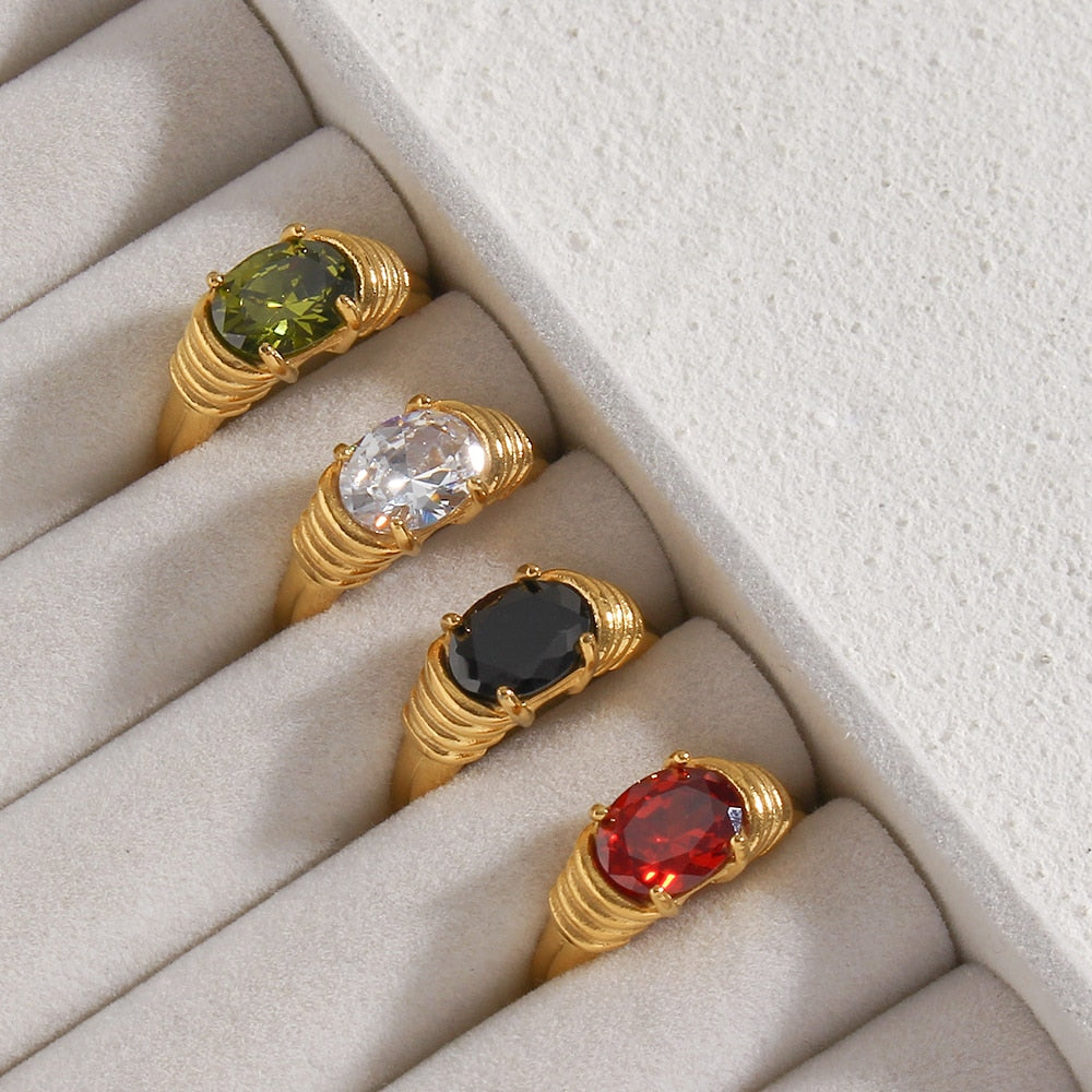 Oval-cut 3A zircon ring with prong setting, 18K gold plated, featuring a sparkling gemstone on a sleek band.