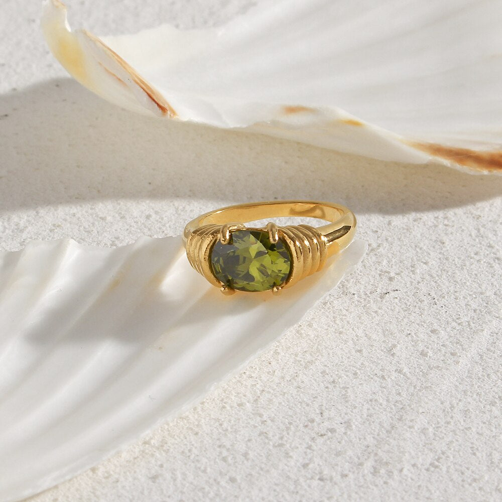 Oval-cut prong setting 3A zircon ring with 18K gold plating, showcasing a sparkling gemstone on a sleek band.