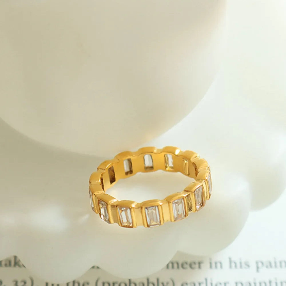 Gold-plated titanium zircon ring from eprolo featuring a sleek design and shiny finish on durable titanium steel.