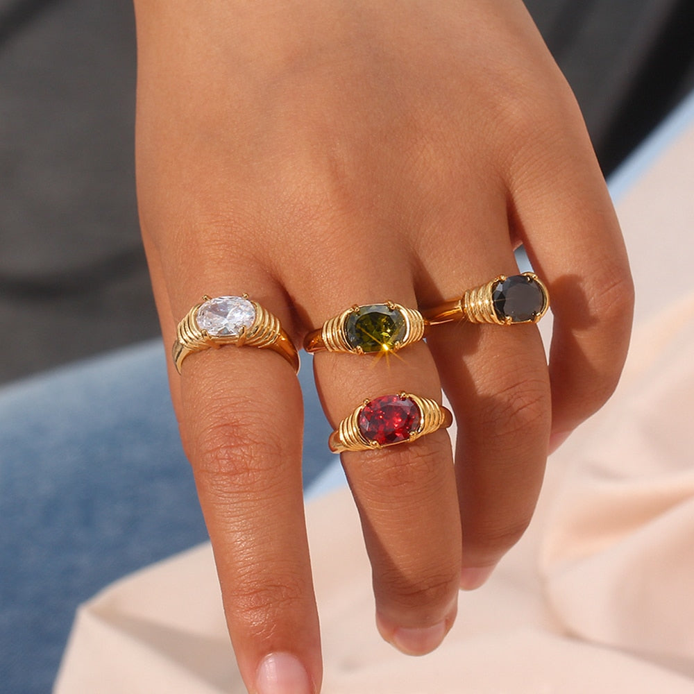 Oval-cut prong setting 3A zircon ring with 18K gold plating, showcasing a sparkling gemstone on a sleek band.