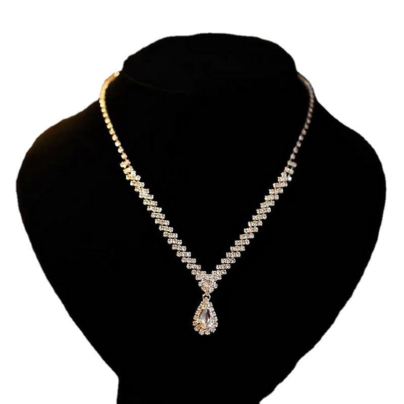 Elegant claw chain water drop necklace and earring set by eprolo featuring delicate water drop charms on a stylish chain.