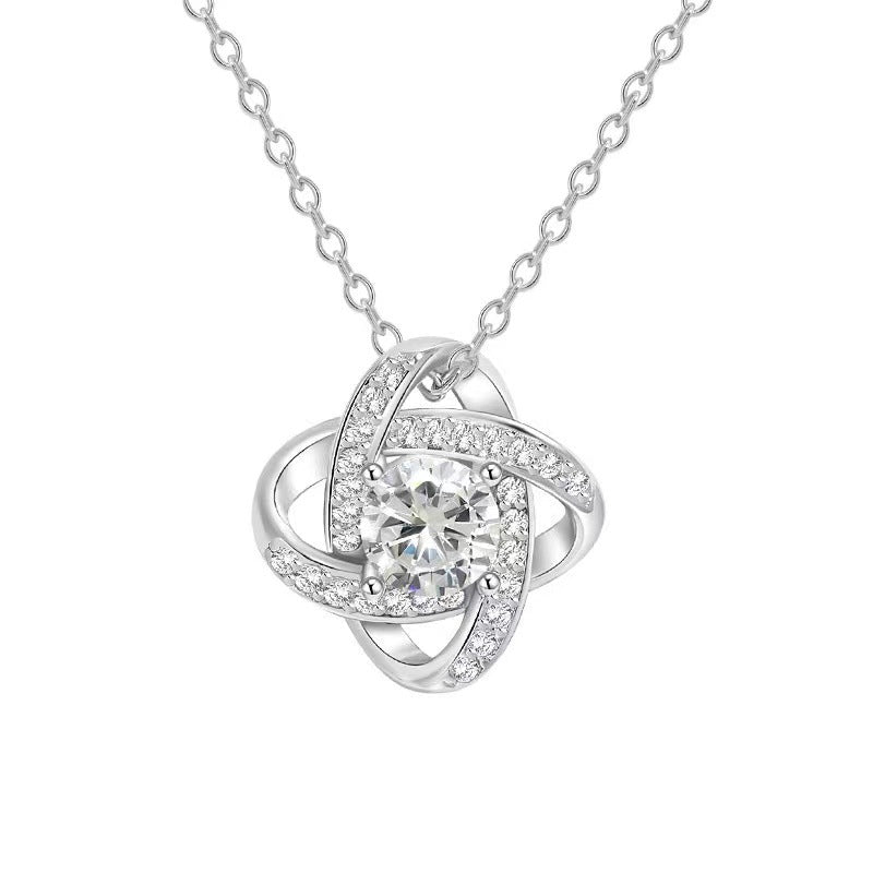 Gold plated spinning lucky clover heart pendant necklace with intricate design, featuring a delicate chain and vibrant gold finish.