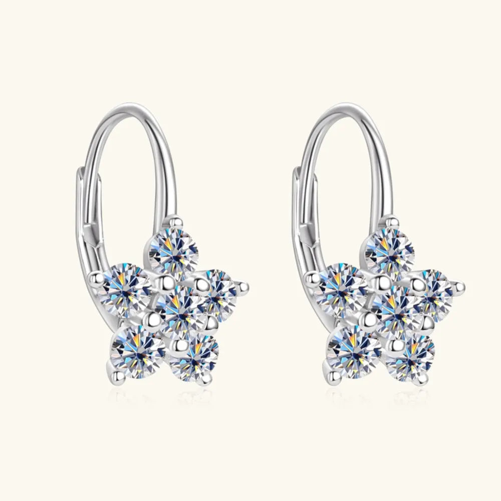 Sterling silver moissanite flower huggie earrings with 1.2 carats, featuring sparkling gemstone details and a secure clasp.