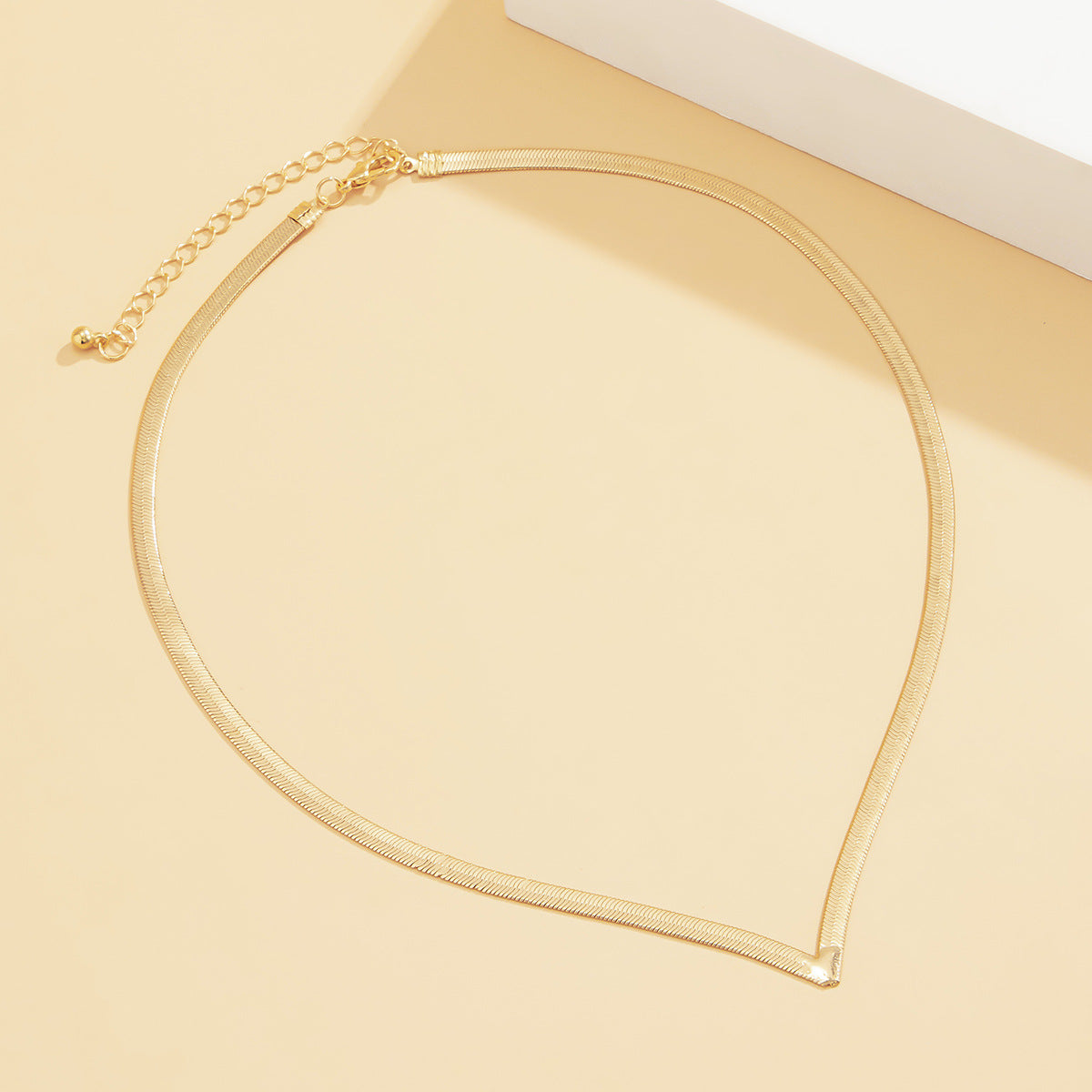 Metal snake bone V-chain necklace from eprolo featuring a bold street style design with intricate bone-like detailing.