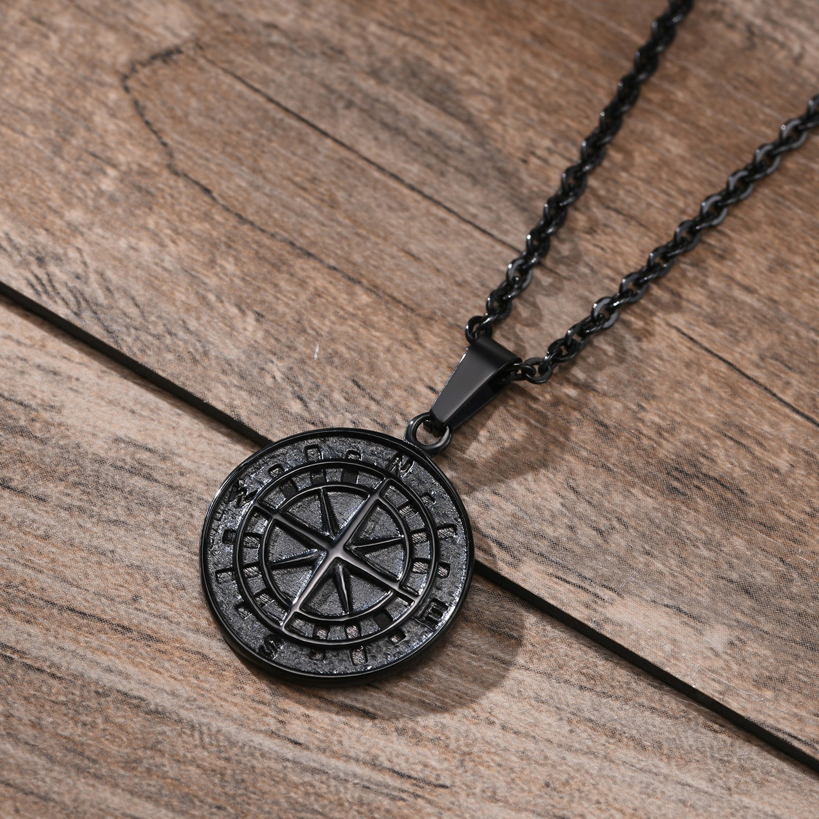 Gold compass coin pendant necklace for men, featuring a detailed compass design, ideal for hip hop style accessories.