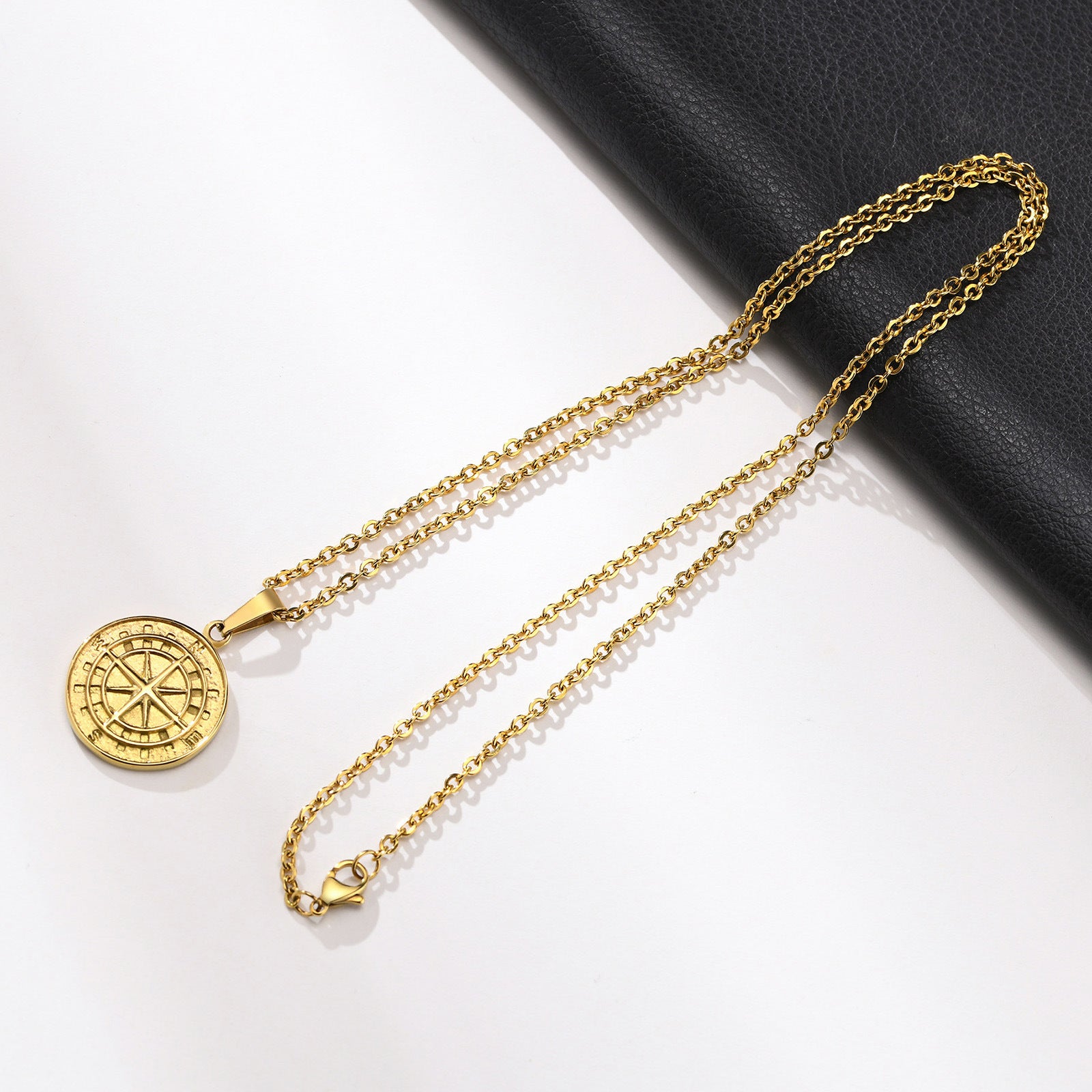 Gold compass coin pendant necklace for men, hip hop style, featuring a detailed compass design on a sleek chain.